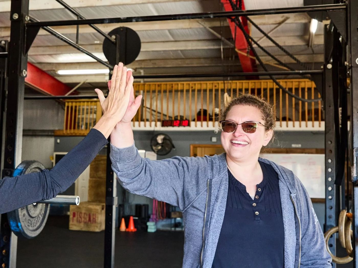 Client high-fiving after a session